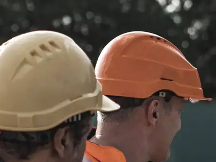 Construction workers wearing safety helmets